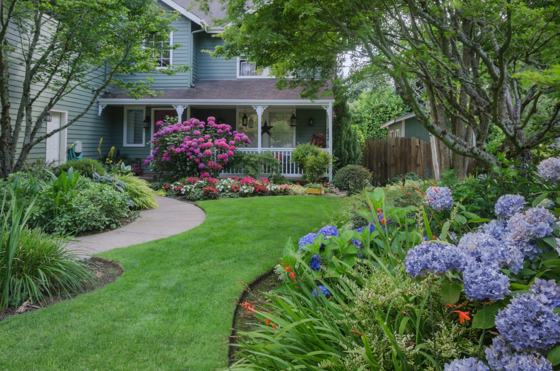 Entrance to a home through a beautiful garden